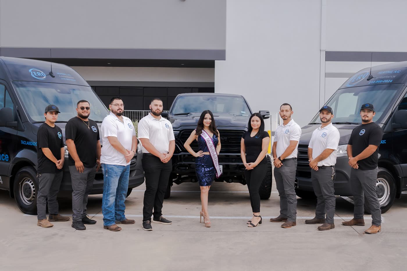 The Zero Heating AC & Refrigeration crew standing in front of their service vans